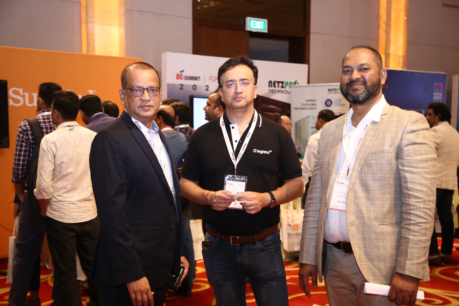 Delegates networking in the exhibition hall